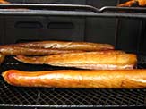 Pellicle in smoked fish. The unsmoked fish will have a greyish shine and the smoked fish will exhibit a golden gloss.
