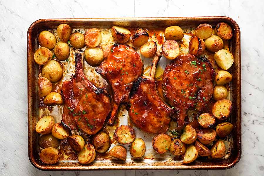 Close up photo of Oven Baked Pork Chops with potatoes, fresh out of the oven